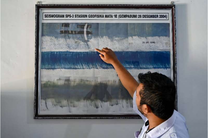 An officer from the geophysics center points to a seismograph system that recorded the 9.3 richter scale on the 2004 Indian Ocean earthquake and tsunami, at a monitoring station in Darul Imarah, Aceh province on December 23, 2024. An officer from the geophysics center points to a seismograph system that recorded the 9.3 richter scale on the 2004 Indian Ocean earthquake and tsunami, at a monitoring station in Darul Imarah, Aceh province on December 23, 2024
