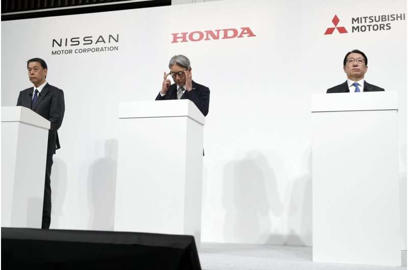 Nissan Chief Executive Makoto Uchida, left, and Honda Chief Executive Toshihiro Mibe, center, and Takao Kato CEO of Mitsubishi Motors, right, attend a joint news conference Monday, Dec. 23, 2024, in Tokyo, Japan. Credit: AP Photo/Eugene Hoshiko Nissan, Honda announce plans to merge, creating world's No. 3 automaker