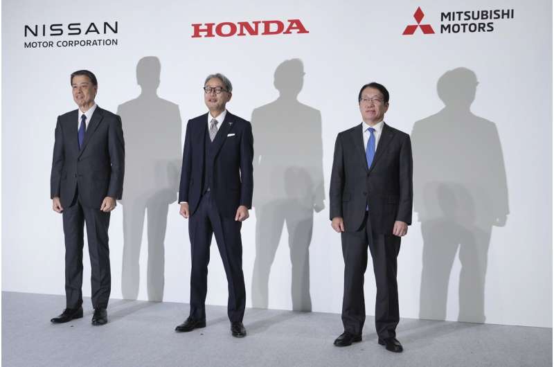 Nissan Chief Executive Makoto Uchida, left, Honda Chief Executive Toshihiro Mibe, center, and Takao Kato, CEO of Mitsubishi Motors, right, pose for photographers during a joint news conference in Tokyo, Japan, Monday, Dec. 23, 2024. Credit: AP Photo/Eugene Hoshiko What a merger between Nissan and Honda means for the automakers and the industry
